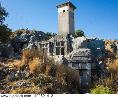 Rock tombs ruins at necropolis of Xanthos Ancient City, Turkey. Old Lycian civilization heritage architecture