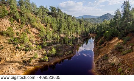 Red Lake At Abandoned Open-pit Copper Mine Near Vretsia, Cyprus. Its Odd Color Derives From High Lev