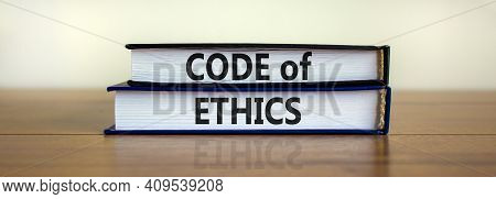 Code Of Ethics Symbol. Concept Words 'code Of Ethics' On Books On A Beautiful Wooden Table, White Ba