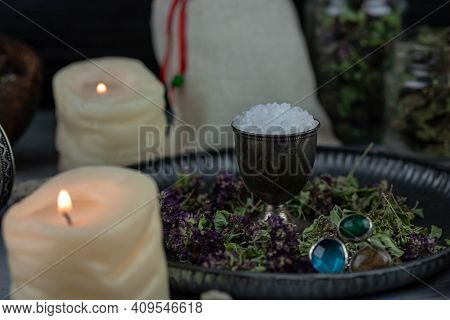 Magic Altar With Mystical Herbs, Salt, Candles And Crystals. Witch Sanctuary Sacred Esoteric Concept