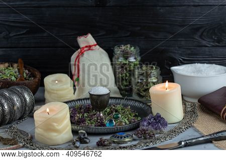 Magic Altar With Mystical Herbs, Salt, Candles And Crystals. Witch Sanctuary Sacred Esoteric Concept