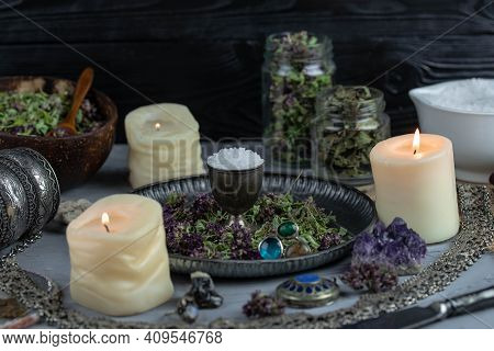 Magic Altar With Mystical Herbs, Salt, Candles And Crystals. Witch Sanctuary Sacred Esoteric Concept