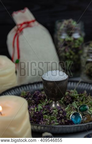 Magic Altar With Mystical Herbs, Salt, Candles And Crystals. Witch Sanctuary Sacred Esoteric Concept