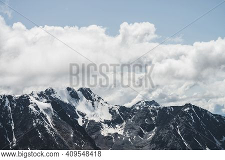 Atmospheric Minimalist Alpine Landscape With Massive Hanging Glacier On Snowy Mountain Peak. Big Bal