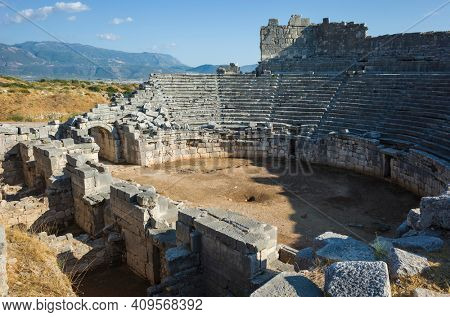 Ruins of Theatre in Xanthos Ancient Lycia City, Turkey. Sunny day, Old Lycian civilization heritage architecture amphitheater