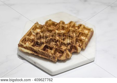 Freshly Croissant Waffle Called Croiffle. A Plain Croissant Baked In Waffle Machine.