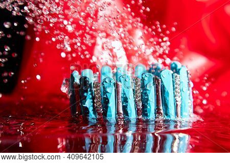Beautiful Blue Bracelet In The Water. The Concept Of Beautiful Female Decorations