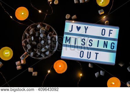 Lightbox With Text Jomo Joy Of Missing Out. The Concept Of Relaxation From Information And Gadgets. 