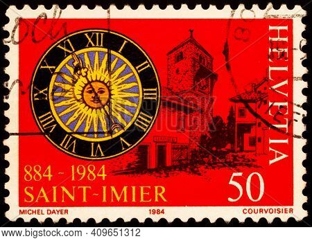 Moscow, Russia - February 20, 2021: Stamp Printed In Switzerland Shows Clock Face And Buildings Of S