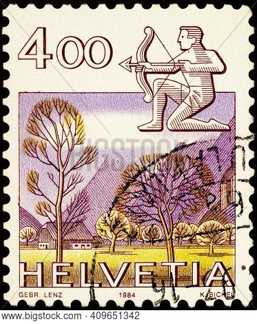 Moscow, Russia - February 22, 2021: Stamp Printed In Switzerland Shows Image Of Sagittarius With A B