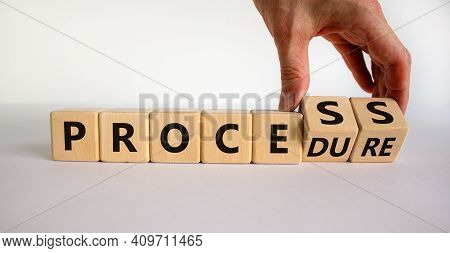 Process Or Procedure Symbol. Businessman Turns Wooden Cubes, Changes A Word 'process' To 'procedure'