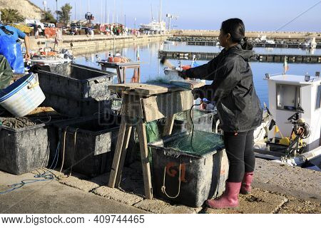 Numana (an), Italy - January 1, 2019: Fisherman At  Numana Port, Riviera Del Conero, Adriatic Sea, N