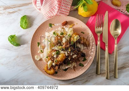 Greek Shredded Lamb Stew Marinated In A White Wine Salmoriglio Sauce With New Potatoes Kalamata Oliv