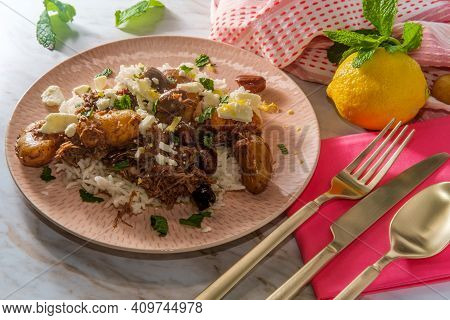 Greek Shredded Lamb Stew Marinated In A White Wine Salmoriglio Sauce With New Potatoes Kalamata Oliv