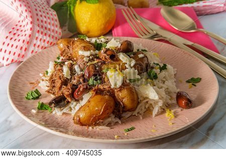 Greek Shredded Lamb Stew Marinated In A White Wine Salmoriglio Sauce With New Potatoes Kalamata Oliv