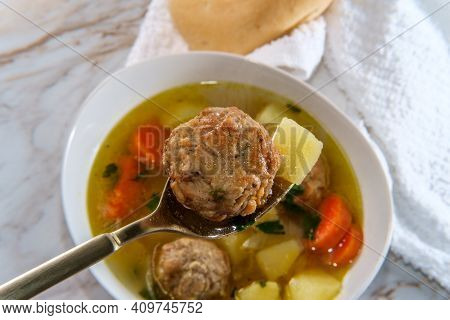 Russian Frikadeller Meatball Soup With Potatoes And Parsley Garnish