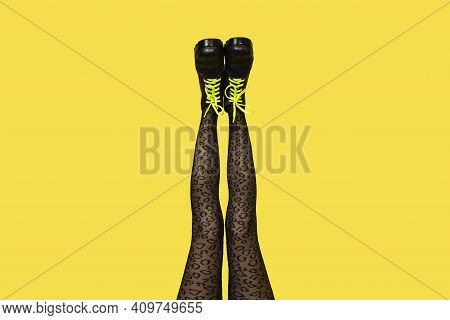 New Gray Female Boots With Bright Yellow Laces On Straight, Long Slender Woman Legs In Gray Tiger Pr