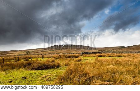 Dead Mans Hill In Open Moorland With Dramatic Clouds. Nidderdale. Yorkshire