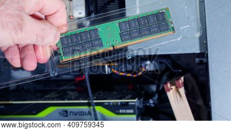 Paris, France - Feb 4, 2021: Pov Male Hand Holding Looking At The New Package Of Micron 64gb Ddr4 Rd