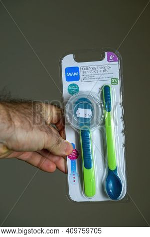 Paris, France - Nov 16, 2018: Pov Male Hand Holding Looking At The New Unpackaged Mam Baby Spoon Mad