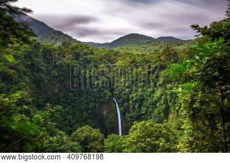 La Fortuna Waterfall In Costa Rica. The Waterfall Is Located On The Arenal River At The Base Of The 