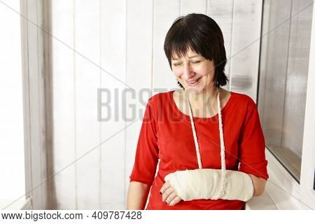 A Broken Arm. Close-up Of The Plaster. A Lady In A Red Jacket With A Bright Manicure. Exercises To R