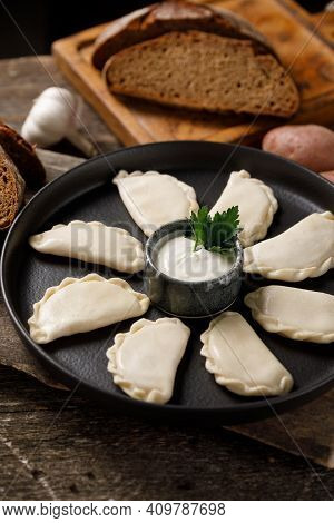 Appetizing Traditional Russian Dumplings, Hand-made With Potatoes. Still Life On A Wooden Board. Clo