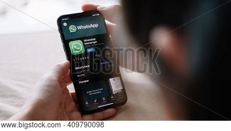 Chiang Mai, Thailand - Apr 18, 2020 : Woman Holding A Iphone And Open Appstore Searching Social Inte