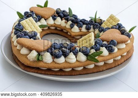 Delicious Cake With Valentine Shape Decorated With Blueberrries And White Chocolade