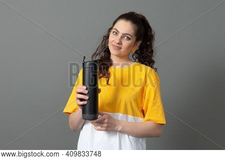 Teenager Holding Eco Reusable Smart Thermo Water Bottle With Drink Reminder, Health Care Concept