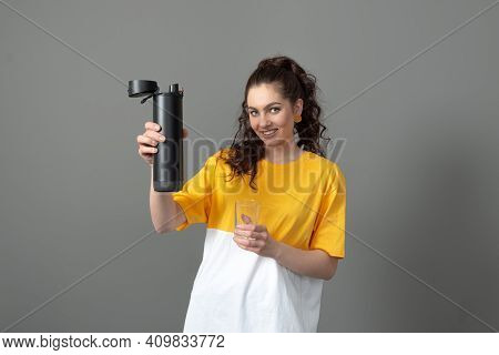 Teenager Holding Eco Reusable Smart Thermo Water Bottle With Drink Reminder, Health Care Concept