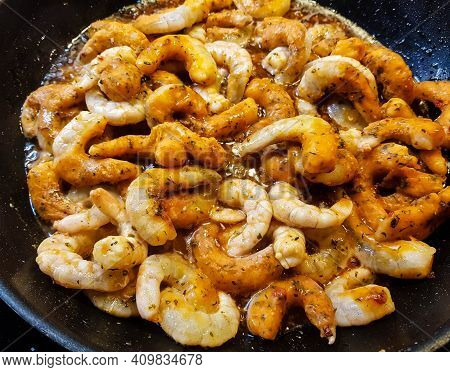 Fried Shrimps With Herbs And Sices On Fresh Salad