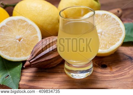 Ice Cold Sweet Limoncello Liqueur Made From New Harvest Of Fresh Ripe Yellow Italian Lemons, Amalfi