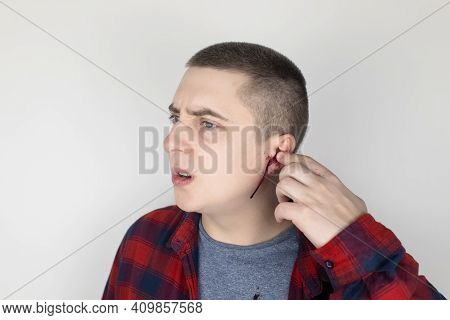 A Man Whose Ear Is Bleeding. Vascular Rupture, Damage To The Tympanic Membrane, Ear Diseases, Oncolo