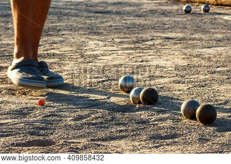 Game Of Petanque On The Ground. Horizontal Image.