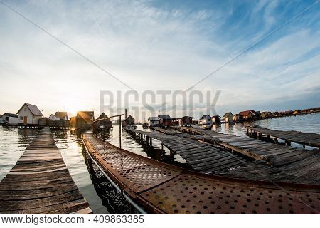 A Picture From Hungary, From A Place Called Bokod. The Local People Have The Wooden Cottages On Pylo