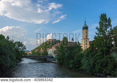 Mur River, The Franciscan Church Tower And The Famous Clock Tower (grazer Uhrturm) In The Background