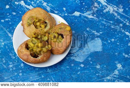Moong Dal Khasta Kachori With Ghugni Curry In A Plate Isolated On Beautiful Blue Background With Cop