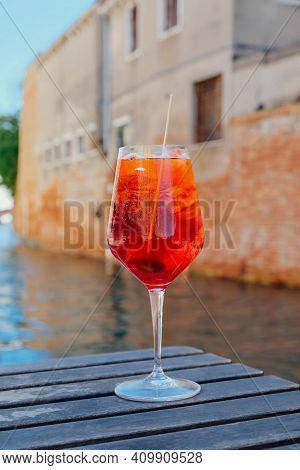 Glass Of Refreshing Aperol Spritz Cocktail Served On The Deck Bar In Venice.