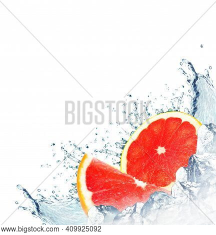 Grapefruit Splash With Water And Ice Cubes Isolated On White Background