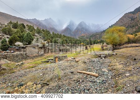 Stone Buildings In Karakorum Mountains Cloudy Weather . High Quality Photo