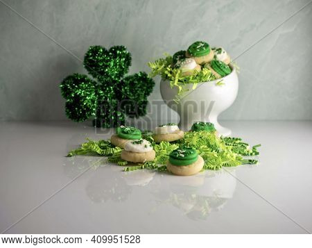 St Patrick's Day Holiday Frosted Sugar Cookies With Green And White Frosting And Sprinkles With Four