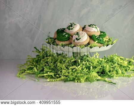 St Patrick's Day Holiday Frosted Sugar Cookies With Green And White Frosting And Sprinkles With Four