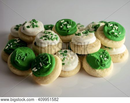 St Patrick's Day Holiday Frosted Sugar Cookies With Green And White Frosting And Sprinkles With Four