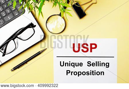 Usp Unique Selling Proposition Is Written In Red On A White Piece Of Paper On A Light Yellow Backgro