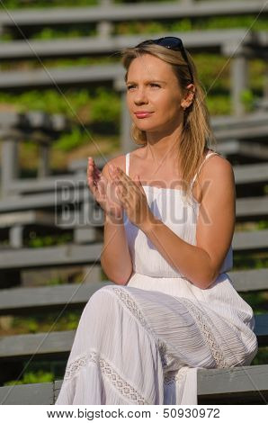 Young pretty woman clapping