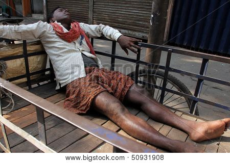 KOLKATA - NOVEMBER 28: Homeless people sleeping on the footpath of Kolkata. on November 28, 2012 in Kolkata, India.