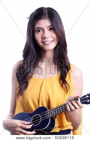 Asian woman playing ukulele