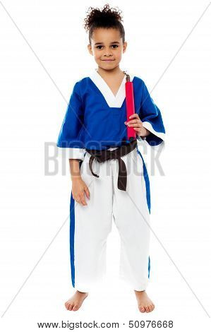 Karate Girl Holding Nunchucks