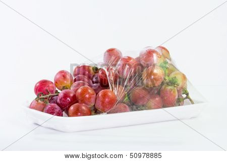 The grapes on a white background